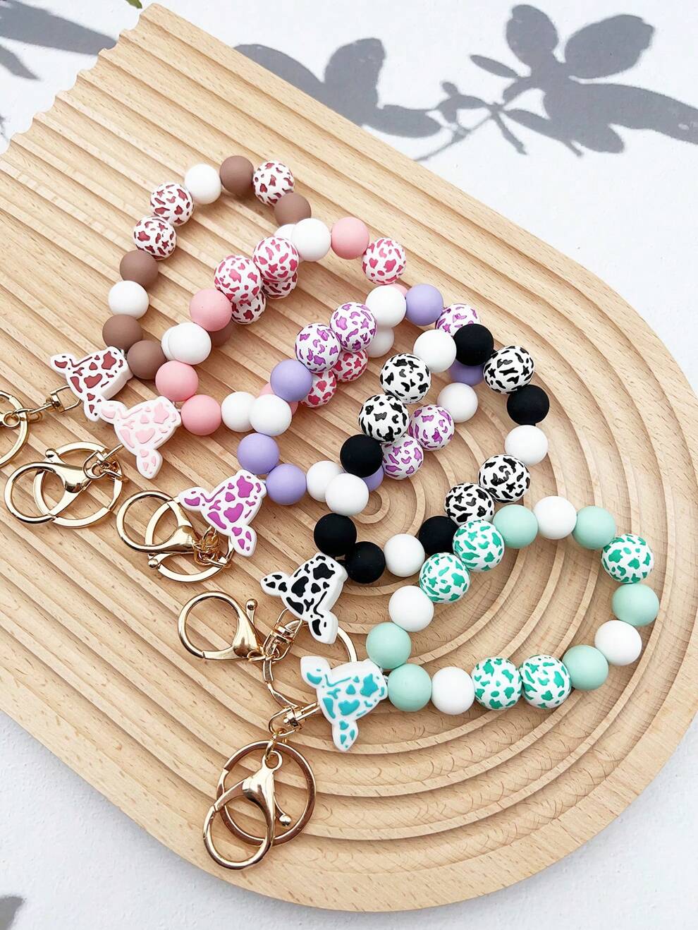 1pc Western Style Cow Head Silicone Beaded Wrist Keychain/Bag Charm Anti-Lost Pendant With Cow Print Wooden Beads, Gift For Friends