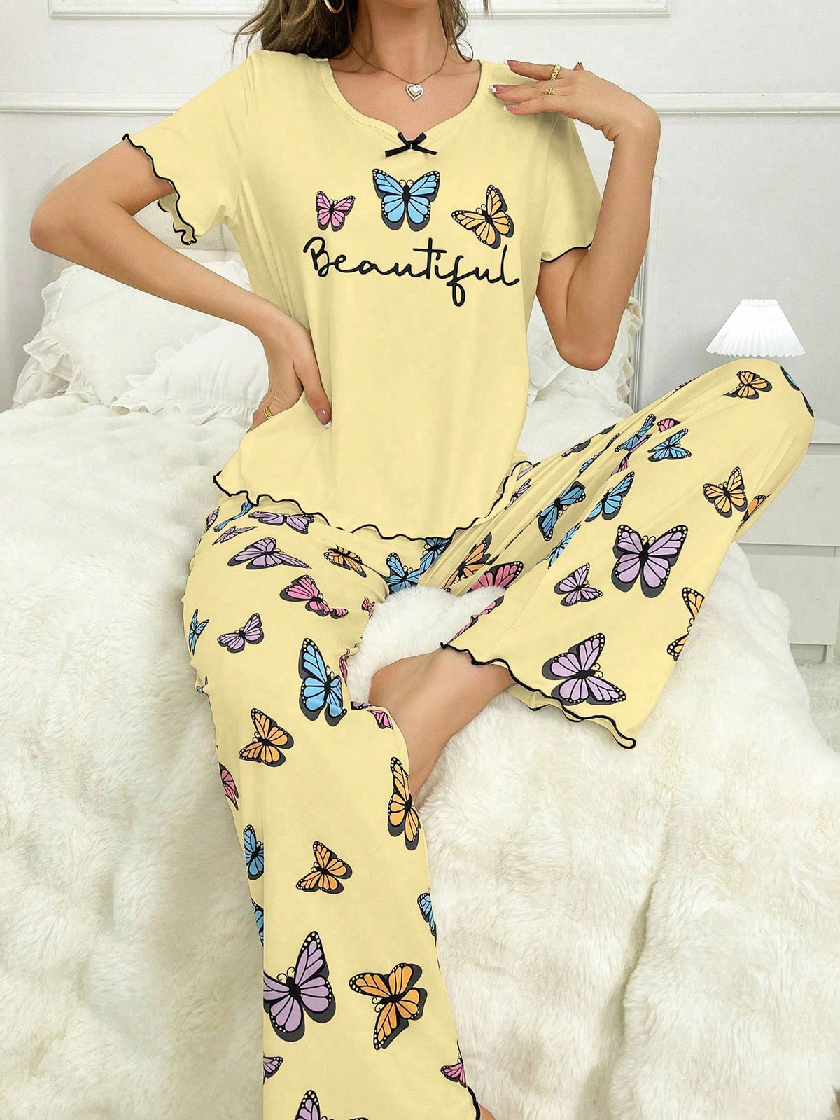 Women's Bowknot Trimmed Butterfly & Letter Print Ruffle Hem Top And Pants Set